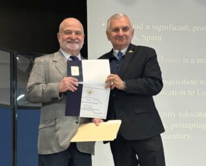 RIJHA past president George Goodwin, left, accepts the proclamation honoring RIJHA from Sen. Jack Reed.
